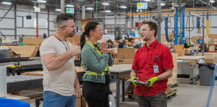 Foliot’s sustainable furniture manufacturers discuss a project in their production area. 